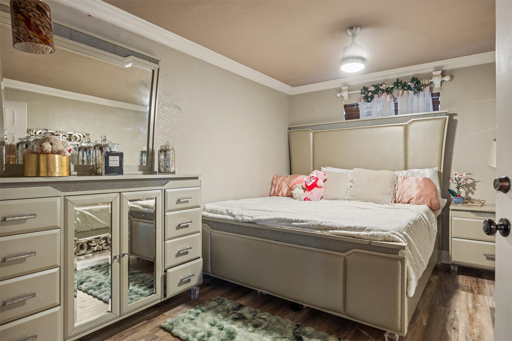 14409 Sandifer Street Austin, TX 78725 - Photo 12 of 31 a bedroom with a bed and a cabinets