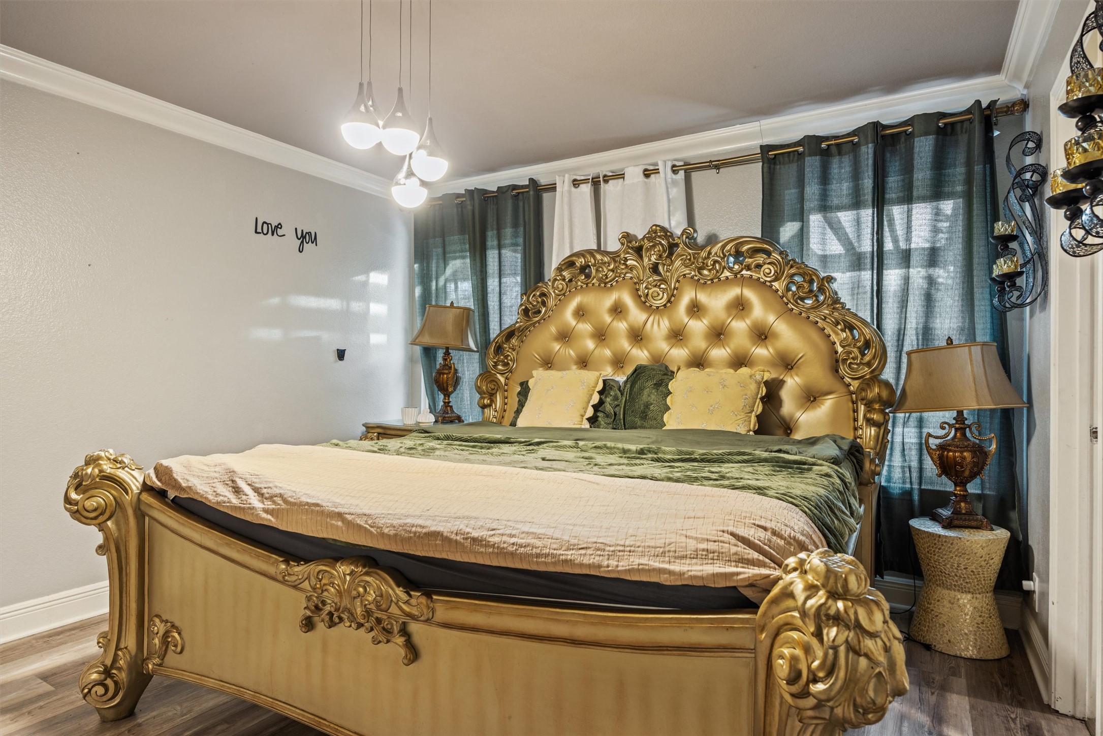 14409 Sandifer Street Austin, TX 78725 - Photo 13 of 31 a bed sitting in a bedroom next to a bathroom sink