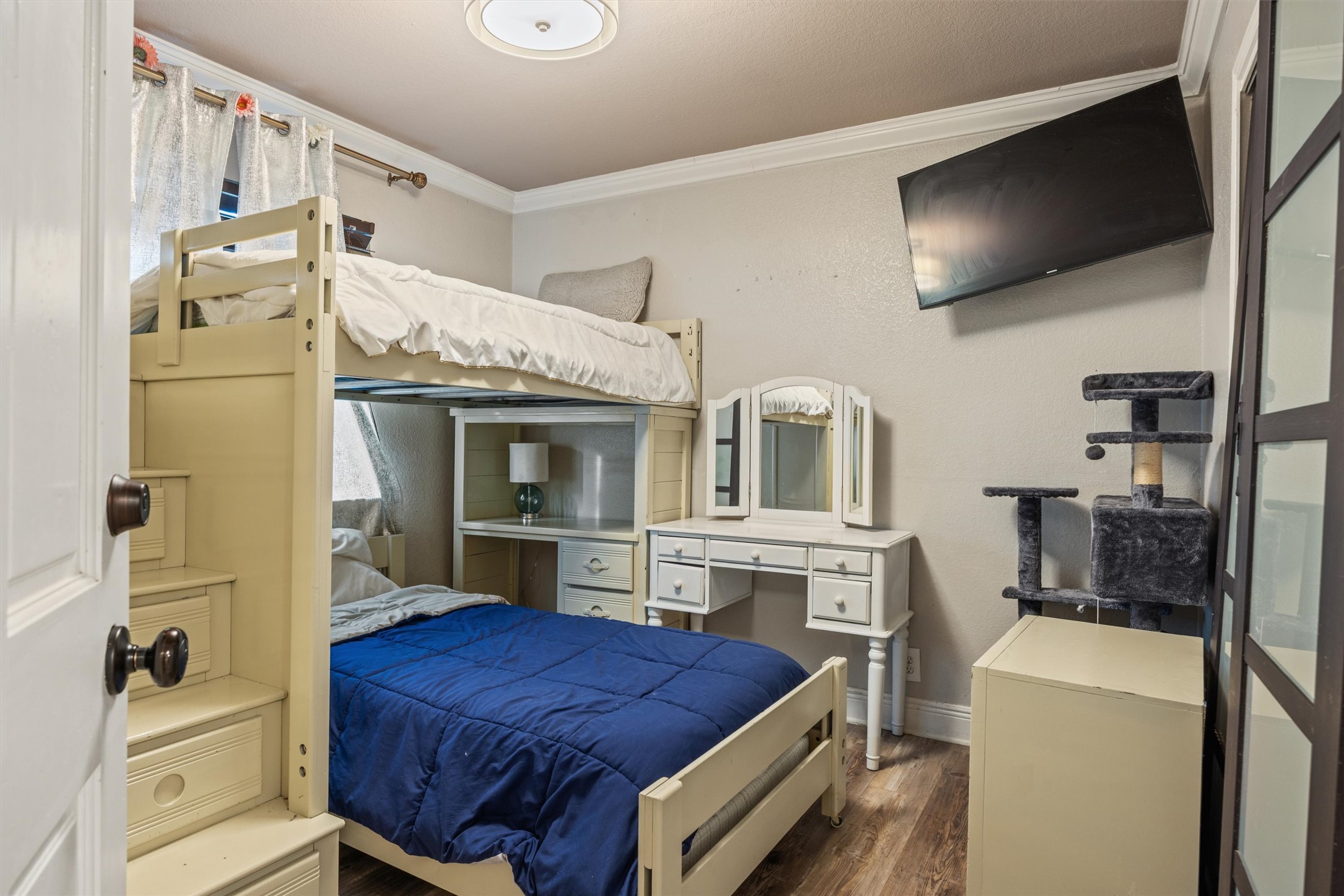14409 Sandifer Street Austin, TX 78725 - Photo 19 of 31 Bedroom with dark wood-type flooring and ornamental molding
