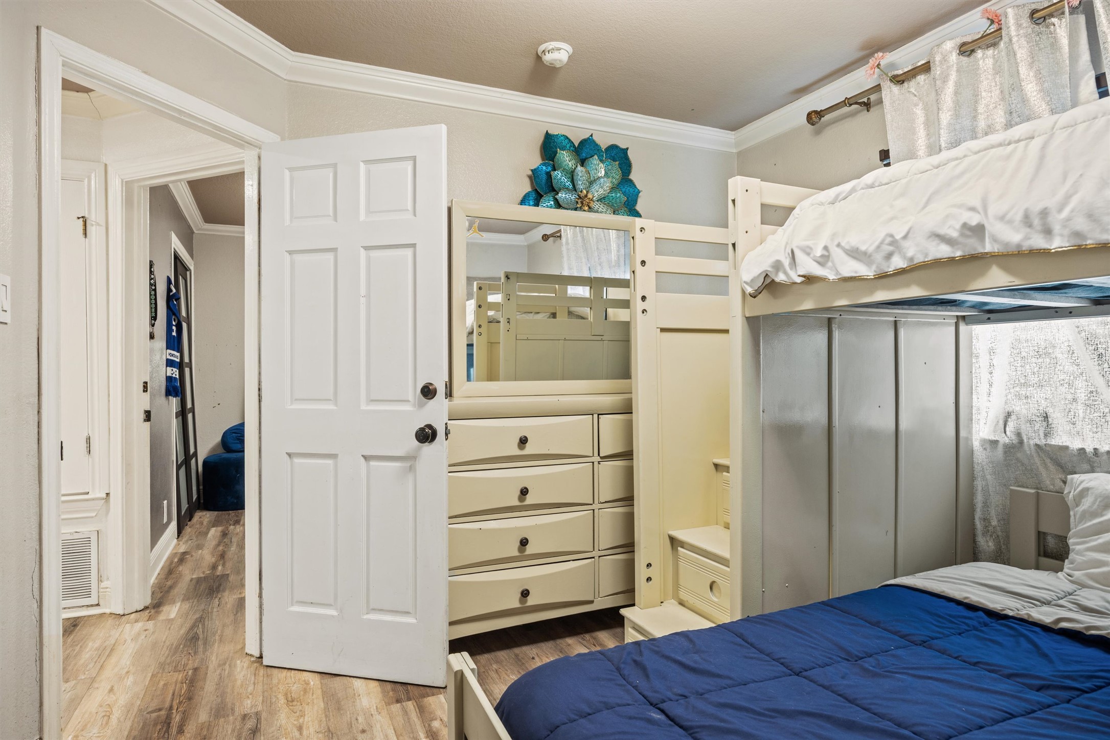 14409 Sandifer Street Austin, TX 78725 - Photo 20 of 31 a view of a bedroom with closet cabinet and wooden floor