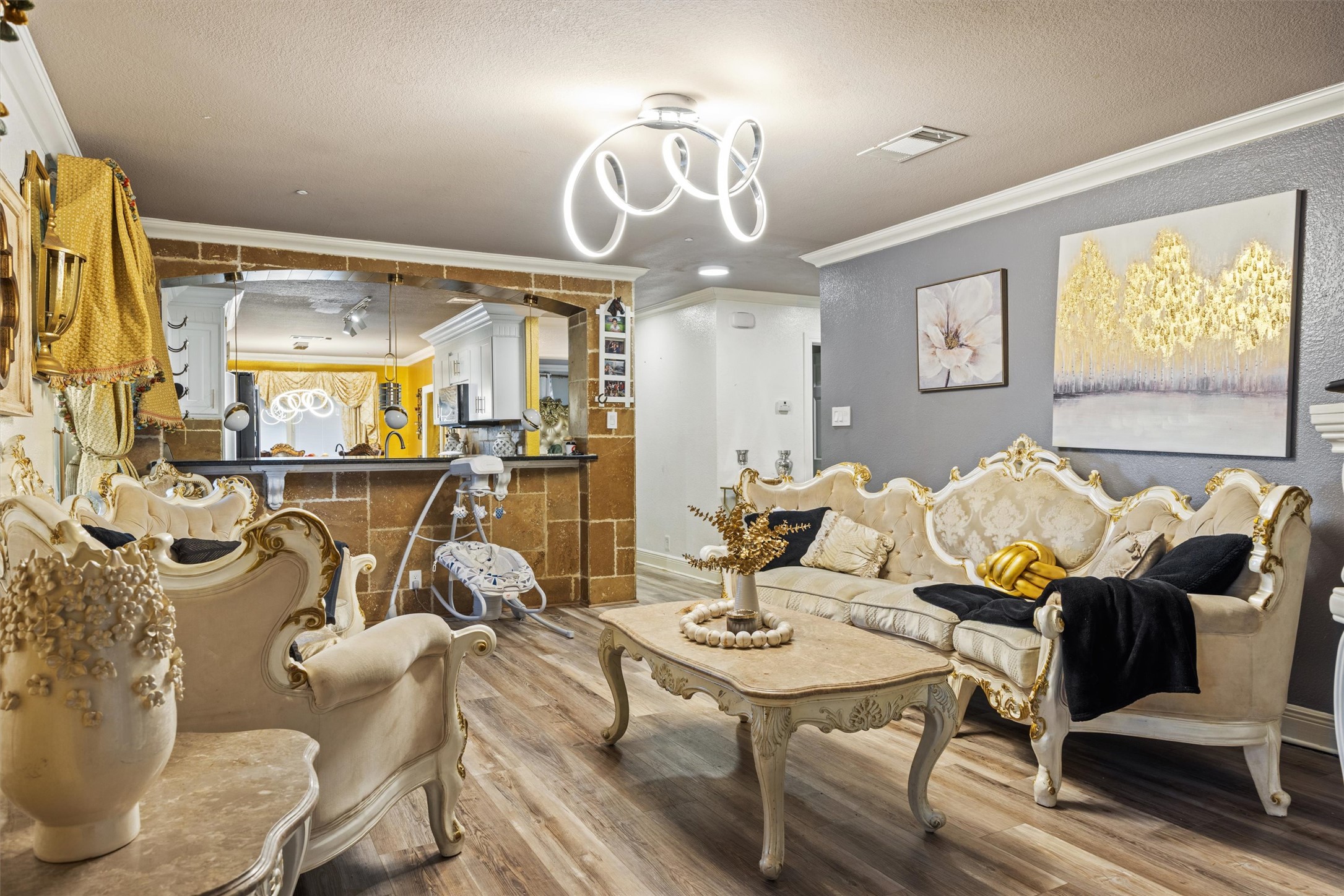 14409 Sandifer Street Austin, TX 78725 - Photo 4 of 31 a view of a dining room with furniture a chandelier and wooden floor