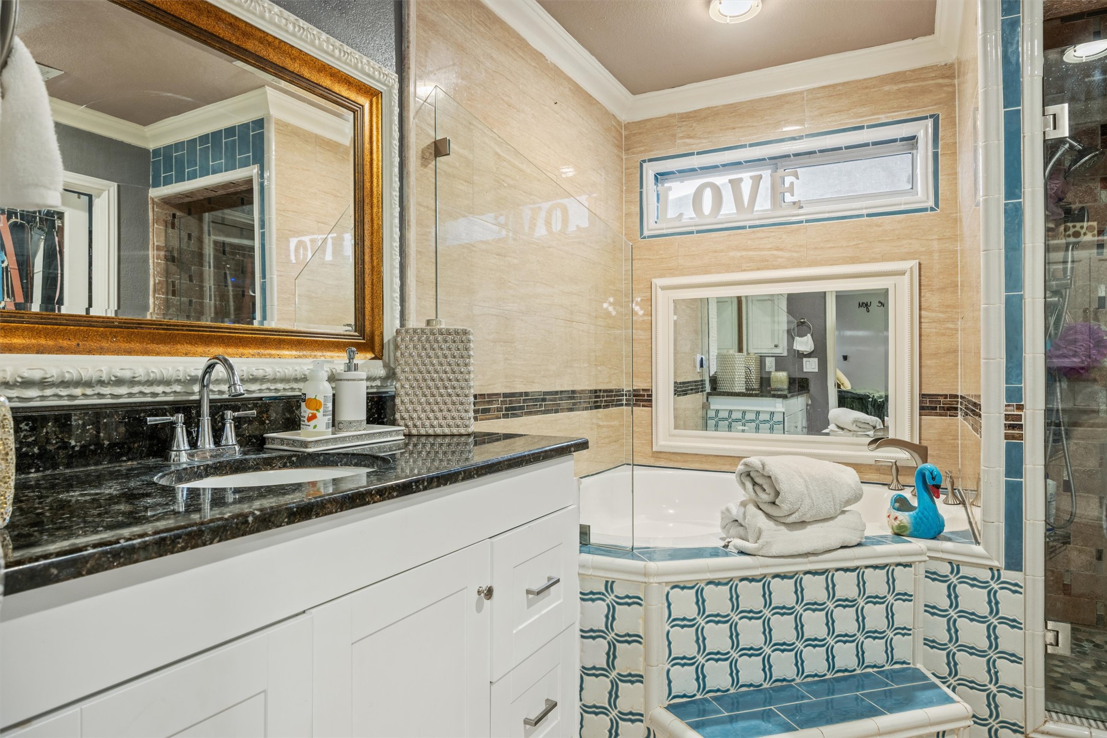14409 Sandifer Street Austin, TX 78725 - Photo 6 of 31 a bathroom with a granite countertop sink and a large mirror