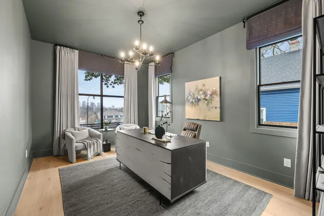 a bathroom with a granite countertop shower a toilet and a sink