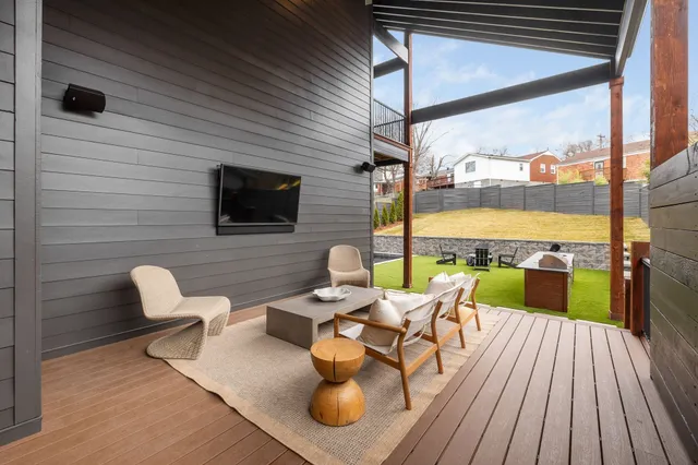 a view of a swimming pool with lounge chairs