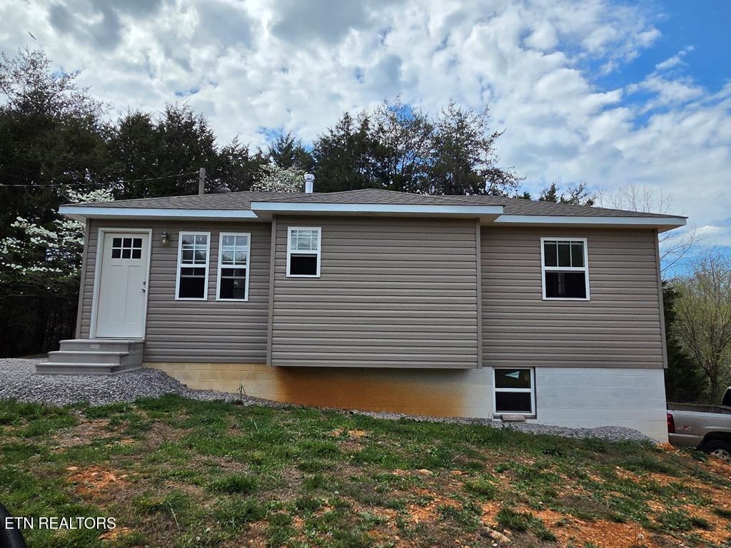 1518 Cummingsville And Sparkman Road Doyle, TN 38559 - Photo 52 of 58 a front view of a house with garden