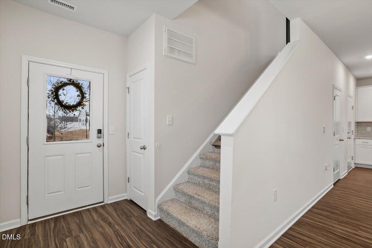 46 Coffee Tree Circle Clayton, NC 27527 - Photo 9 of 36 a view of entryway with wooden floor