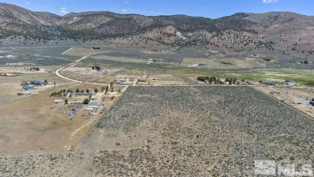 a view of a town with mountains in the background