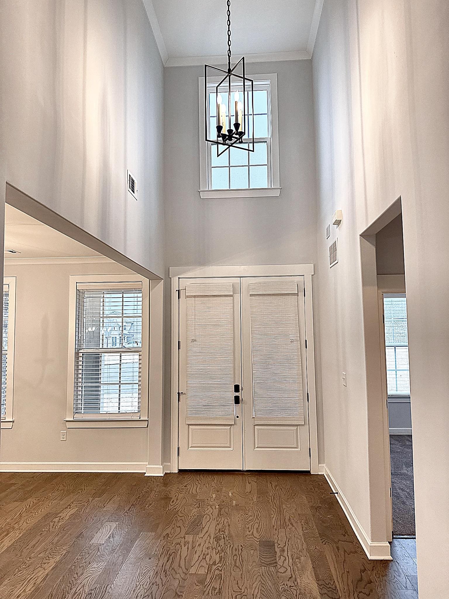 6398 Sallows Cove Bartlett, TN 38135 - Photo 13 of 31 an empty room with wooden floor cabinet and windows