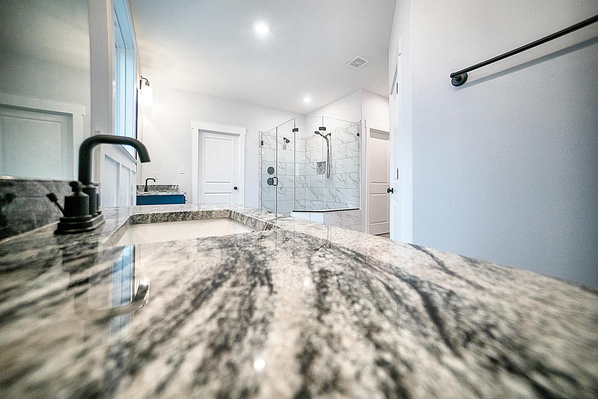 6398 Sallows Cove Bartlett, TN 38135 - Photo 16 of 31 a bathroom with a sink and a shower