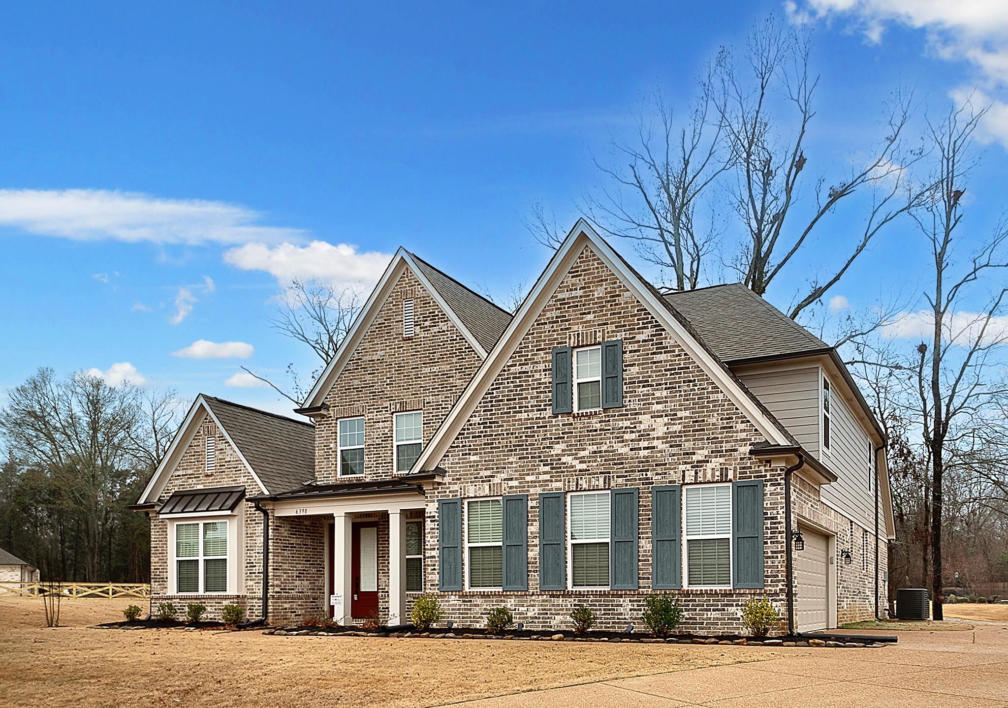 6398 Sallows Cove Bartlett, TN 38135 - Photo 2 of 31 a front view of a house with a yard