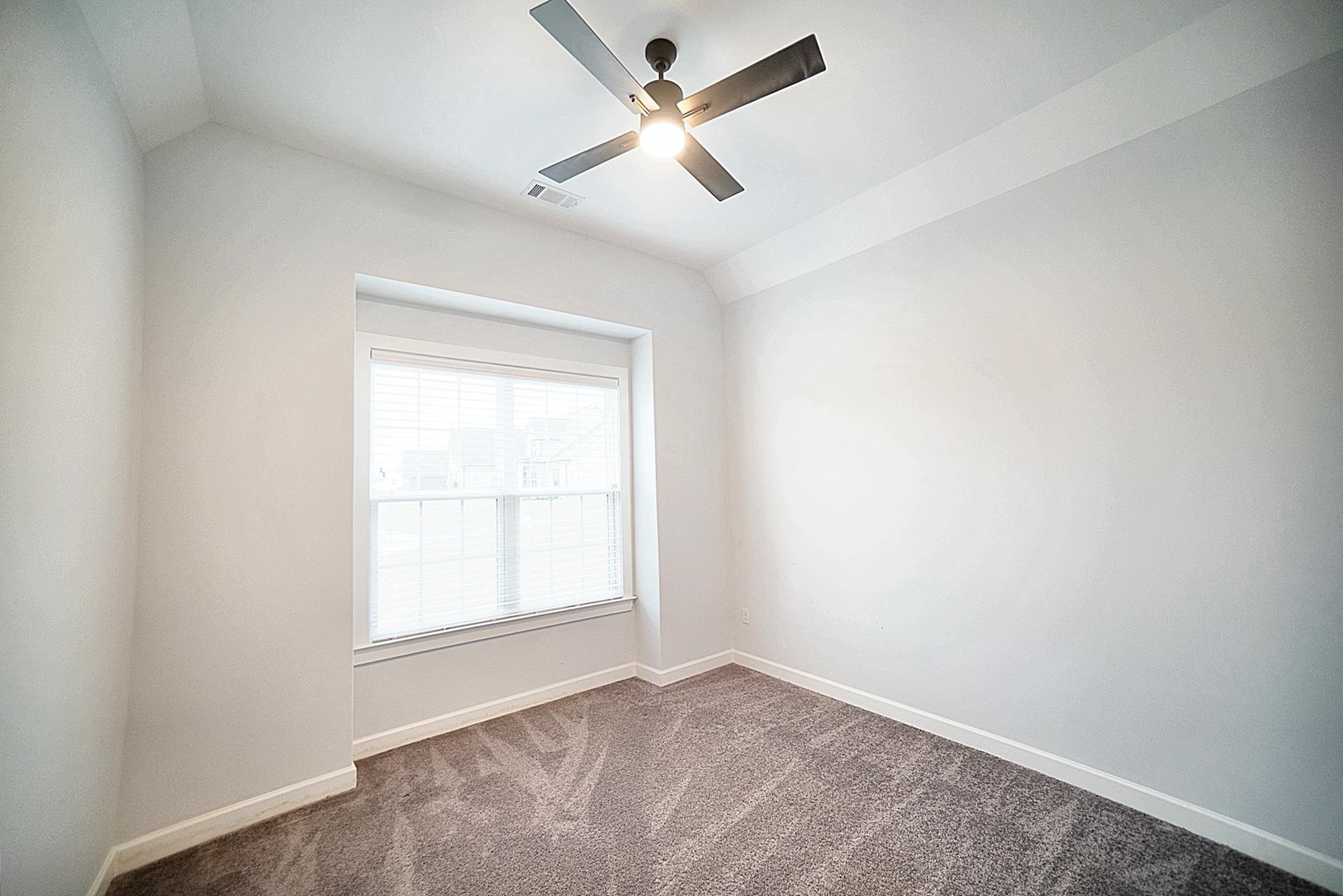 6398 Sallows Cove Bartlett, TN 38135 - Photo 21 of 31 an empty room with a window and a fan