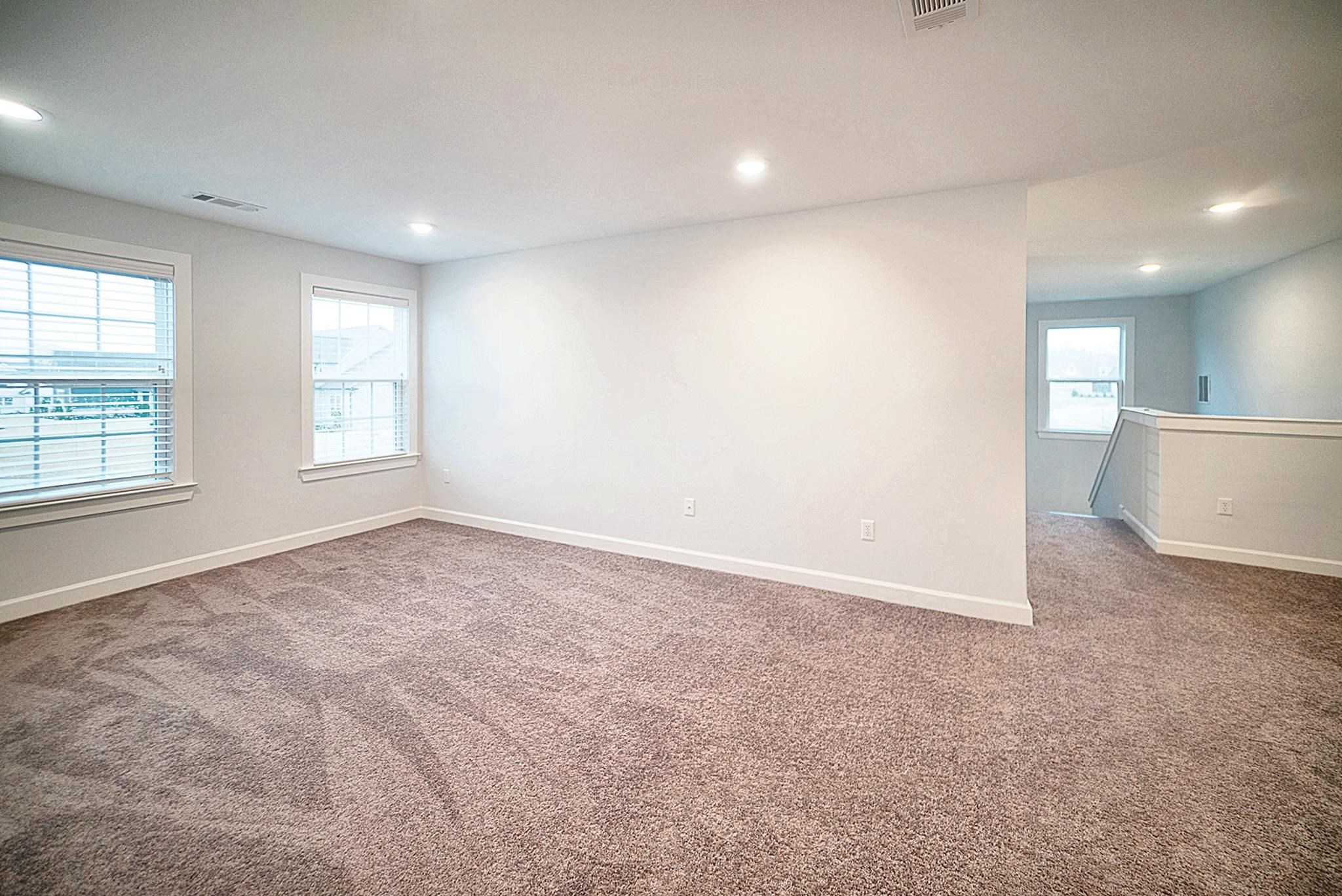 6398 Sallows Cove Bartlett, TN 38135 - Photo 22 of 31 an empty room with windows and closet