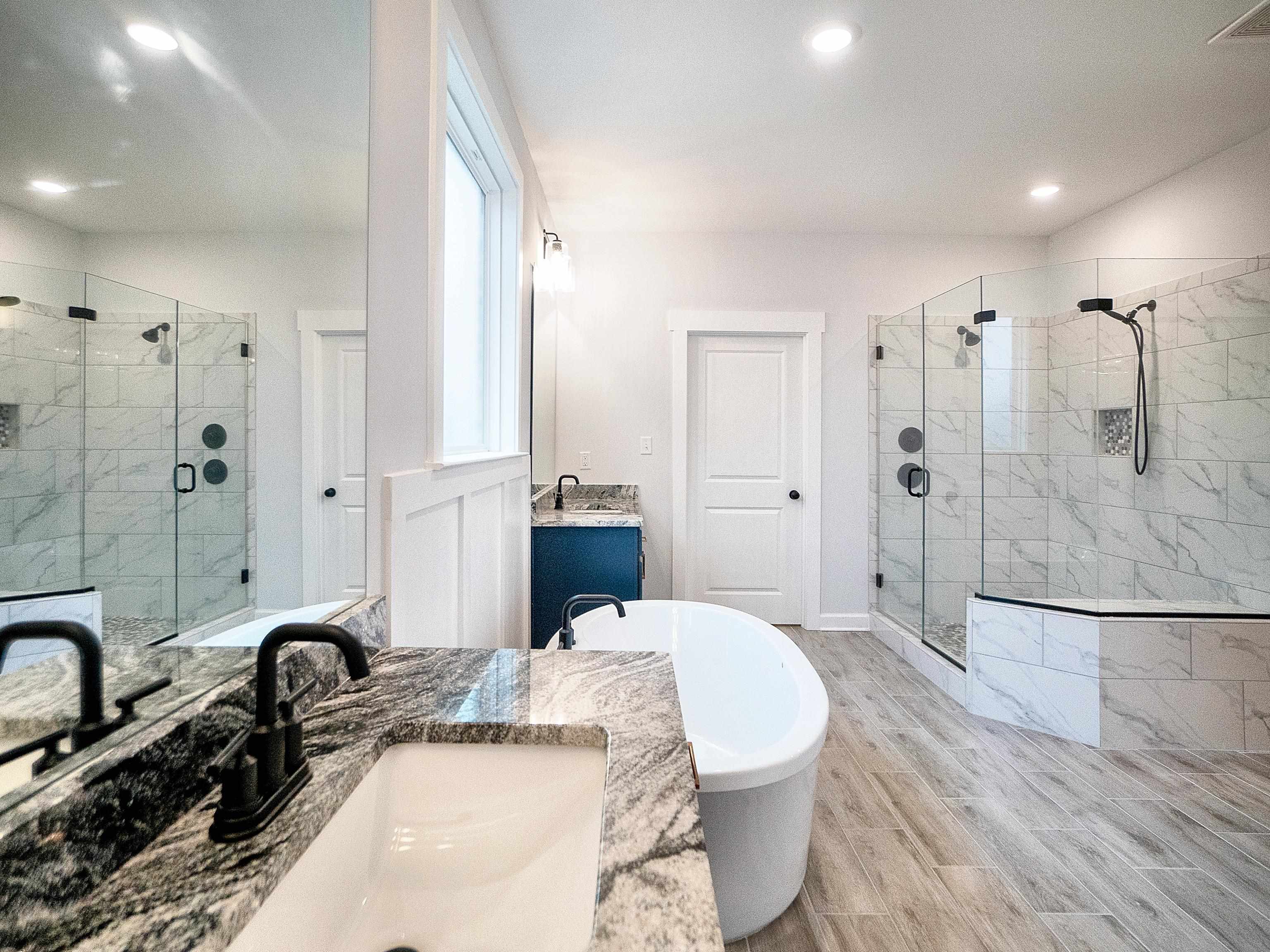 6398 Sallows Cove Bartlett, TN 38135 - Photo 24 of 31 a bathroom with a granite countertop sink and a mirror