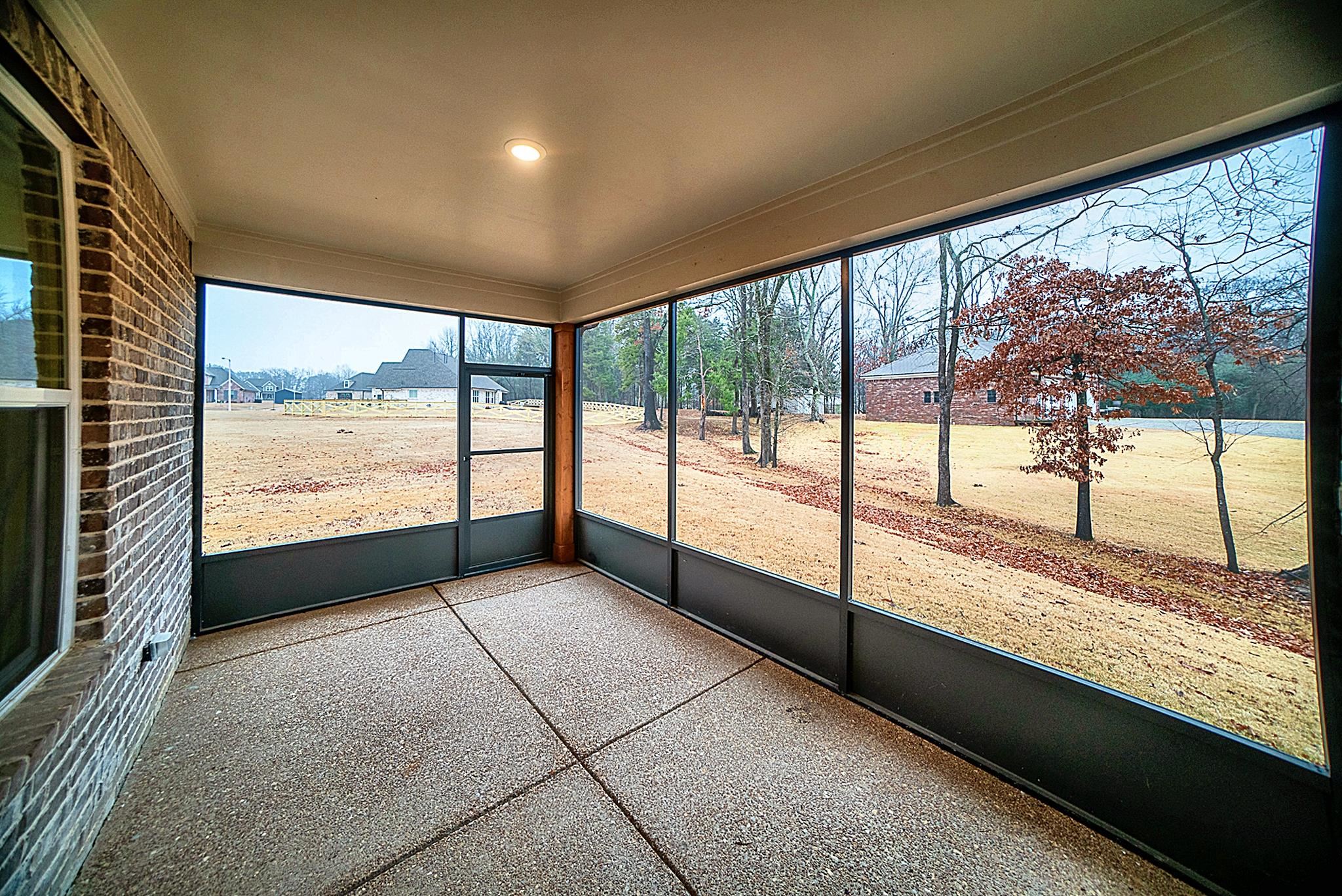 6398 Sallows Cove Bartlett, TN 38135 - Photo 27 of 31 a view of an empty room with wooden floor and iron stairs