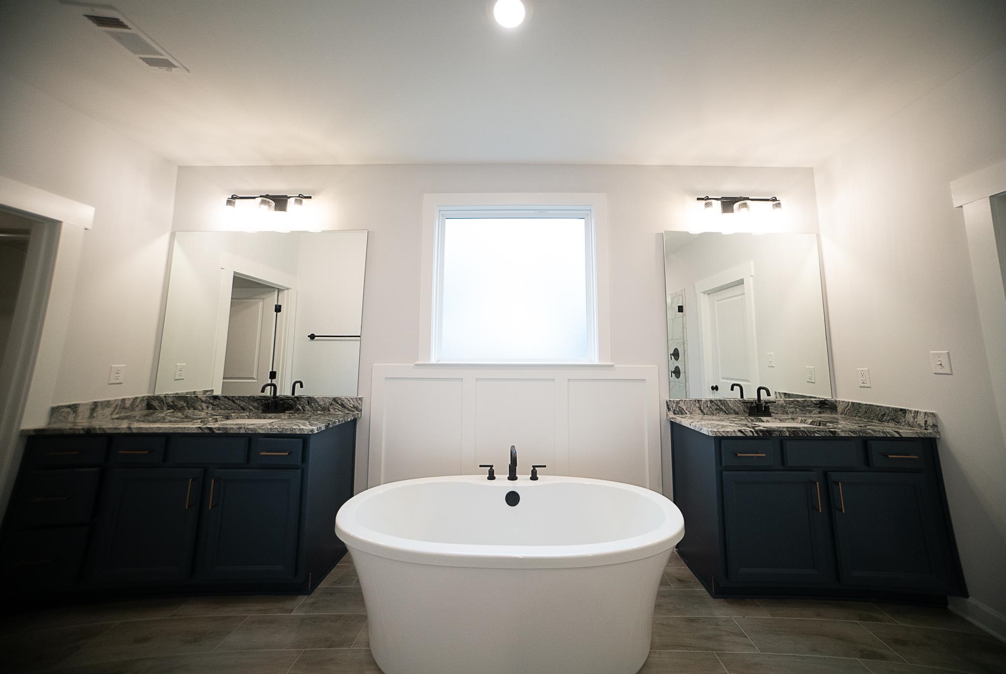 6398 Sallows Cove Bartlett, TN 38135 - Photo 30 of 31 a bathroom with a sink and a mirror