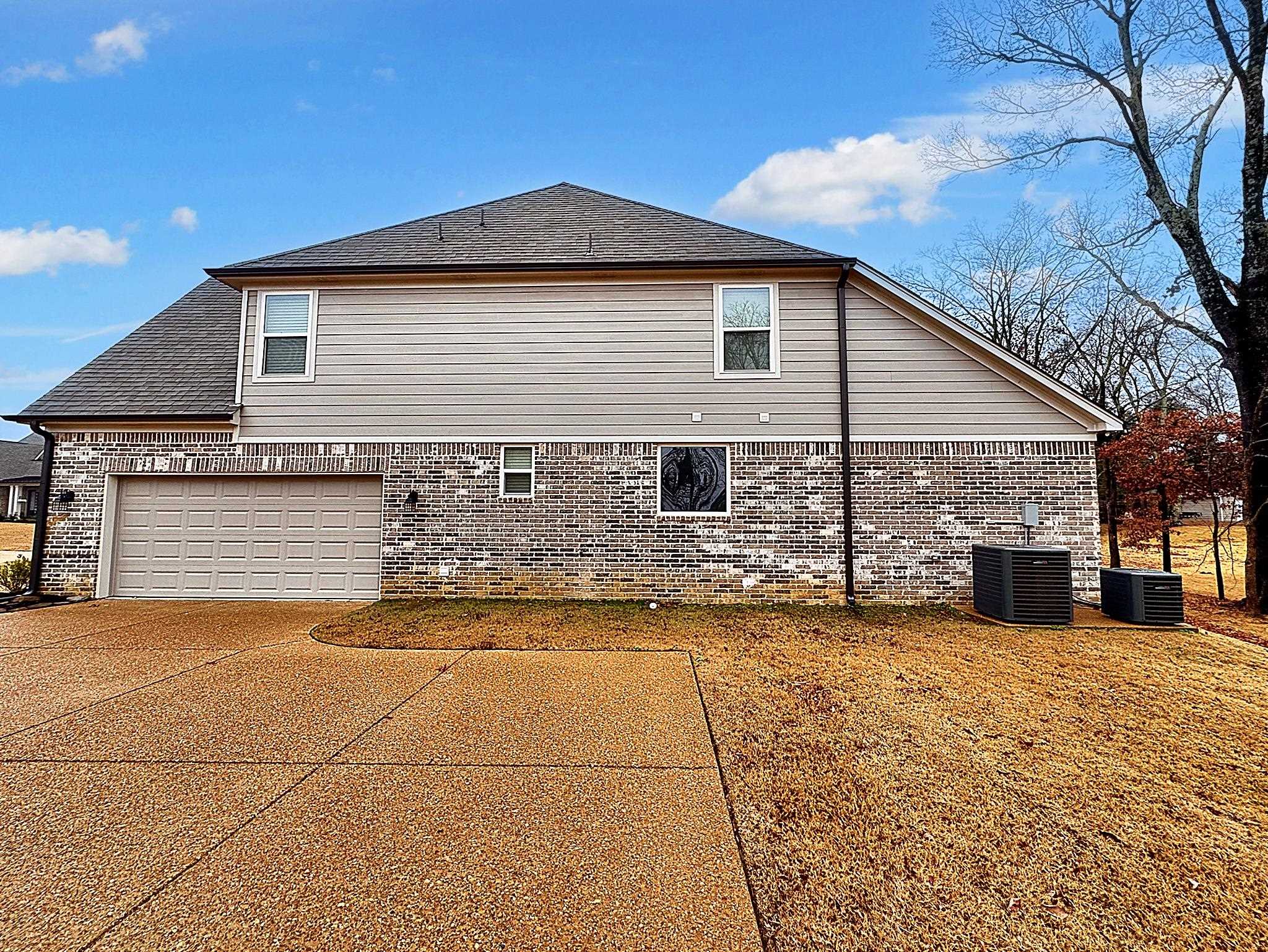 6398 Sallows Cove Bartlett, TN 38135 - Photo 3 of 31 a front view of house with yard and trees in the background