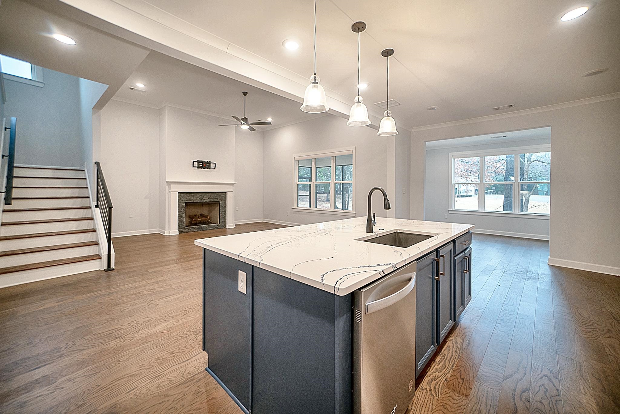6398 Sallows Cove Bartlett, TN 38135 - Photo 4 of 31 a kitchen with a stove a sink and wooden floor