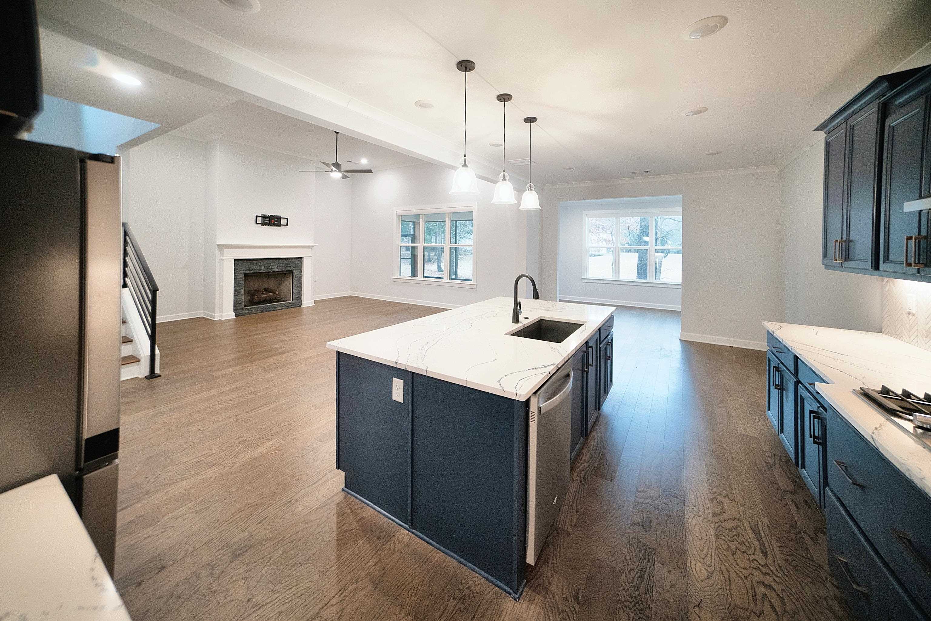6398 Sallows Cove Bartlett, TN 38135 - Photo 6 of 31 a kitchen with sink stove and refrigerator