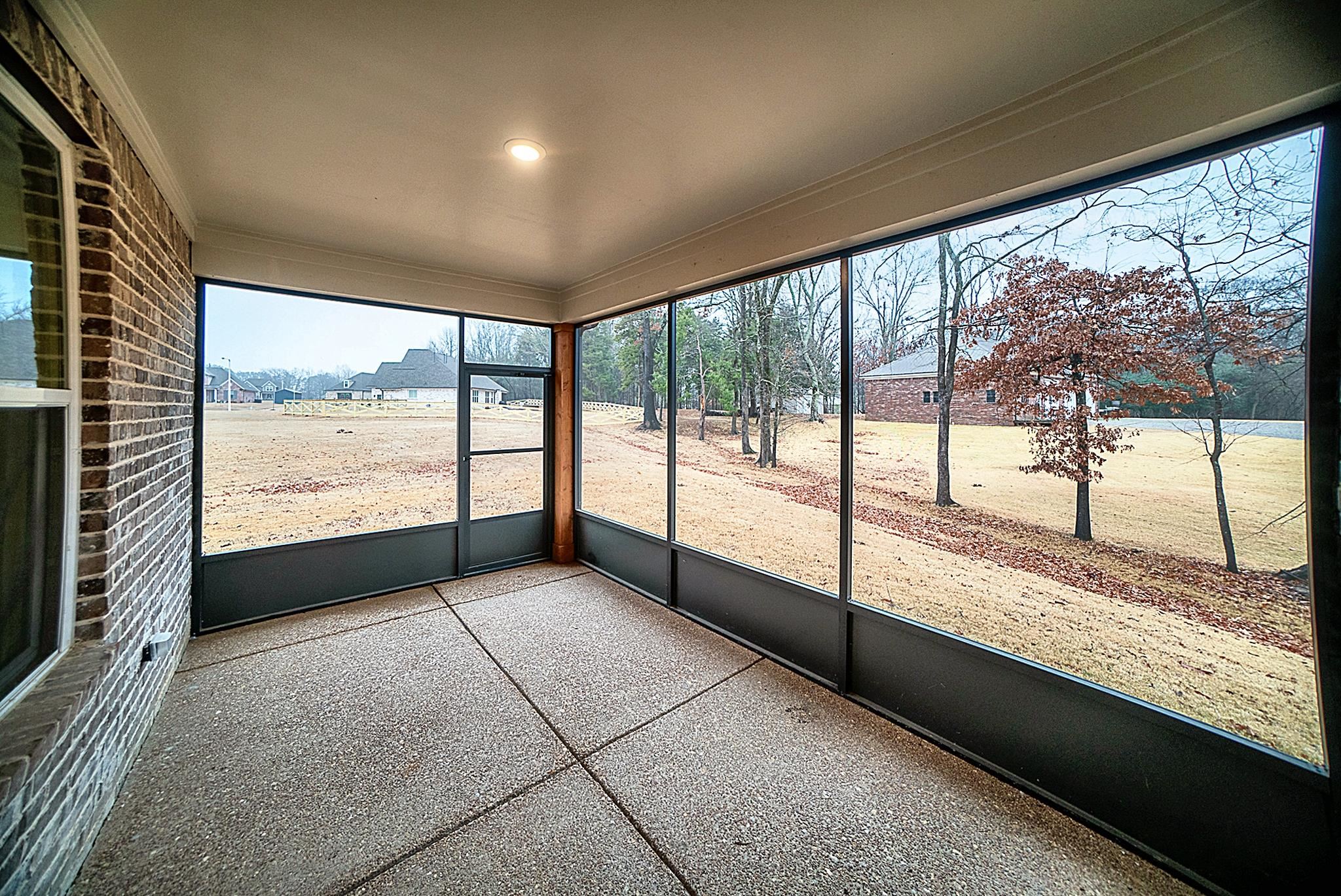 6398 Sallows Cove Bartlett, TN 38135 - Photo 8 of 31 a view of an empty room with a large window