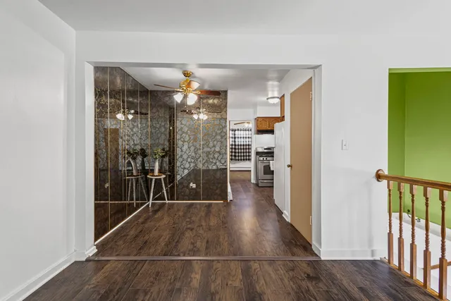 a view of gallery with wooden floor