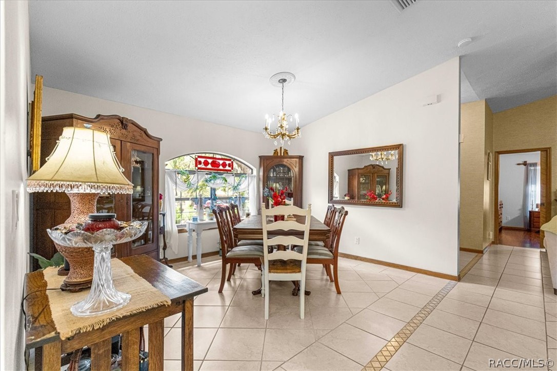 2964 South Cygnet Terrace Inverness, FL 34450 - Photo 11 of 67 a view of a dining room with furniture and chandelier