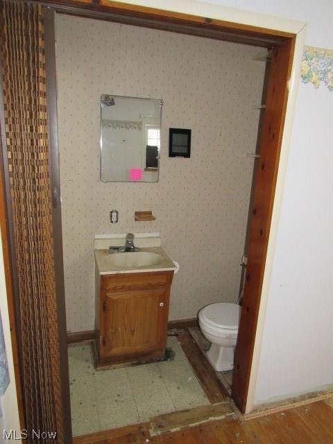 3102 State Road Vermilion, OH 44089 - Photo 39 of 45 Bathroom with toilet and large vanity