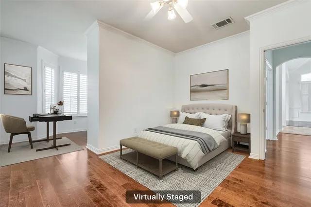 a bedroom with a bed and a chair