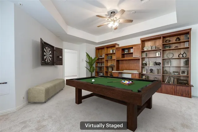 a living room with furniture a bookshelf and a bookshelf