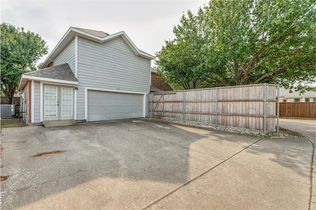 a view of backyard and garage