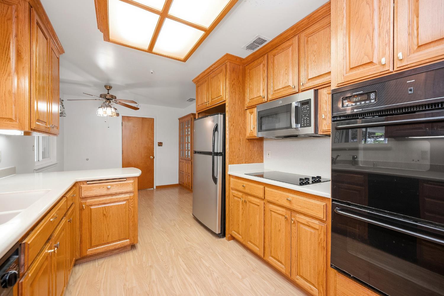 7349 Green Valley Road Placerville, CA 95667 - Photo 11 of 41 2 ovens, 1 full and a 1/2 oven below. Countertops appear to be Corian.