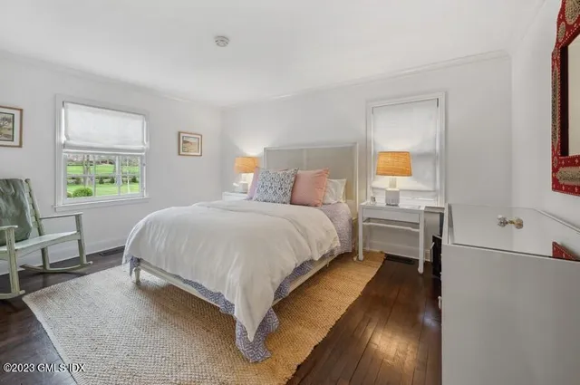 a bed room with a bed and a tv