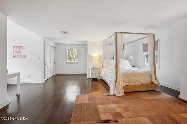 a bed room with a bed and a night stand