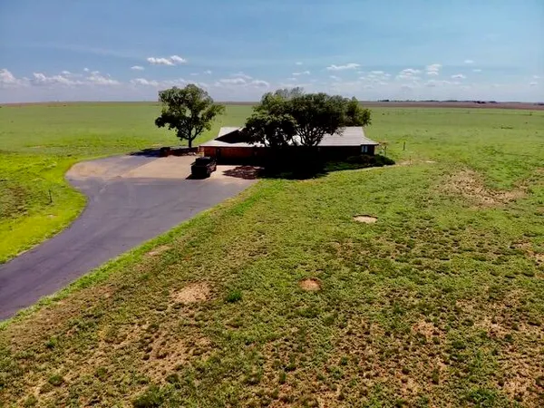 a view of a lake with a yard