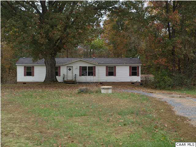 2965 Cedar Lane Road Kents Store, VA 23084 - Photo 1 of 20 a house with trees in front of it