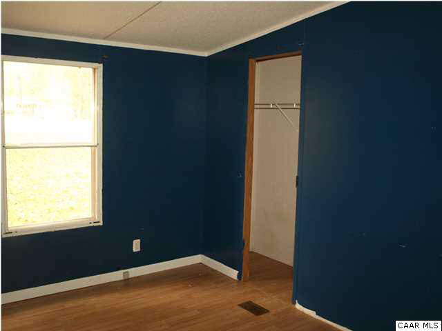 2965 Cedar Lane Road Kents Store, VA 23084 - Photo 13 of 20 a view of an empty room with window
