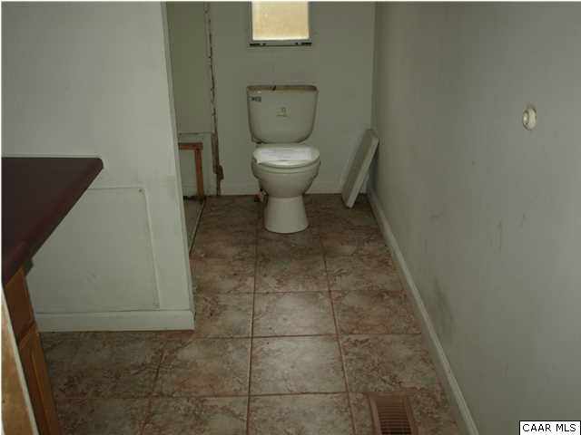2965 Cedar Lane Road Kents Store, VA 23084 - Photo 17 of 20 a bathroom with a toilet and a shower
