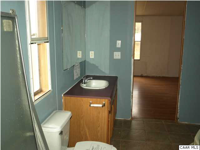 2965 Cedar Lane Road Kents Store, VA 23084 - Photo 20 of 20 a bathroom with a sink and a toilet