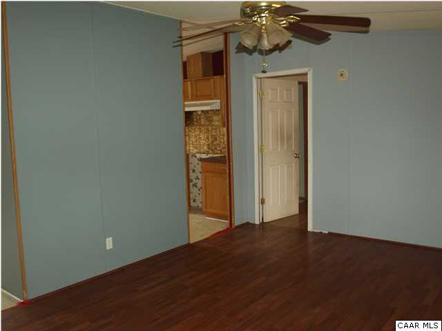 2965 Cedar Lane Road Kents Store, VA 23084 - Photo 7 of 20 an empty room with a wooden door