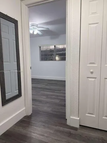 a view of front door with wooden floor