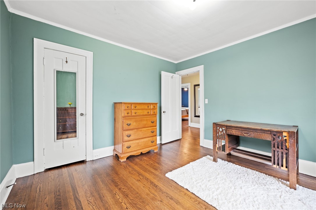 12727 Cedar Road Cleveland Heights, OH 44106 - Photo 24 of 32 Bedroom with hardwood floors and crown molding