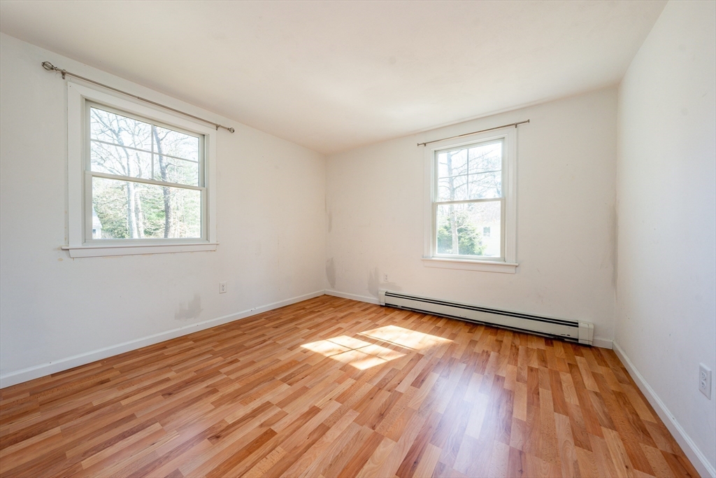 67 Crawford Road Barnstable, MA 02635 - Photo 13 of 26 an empty room with wooden floor and windows