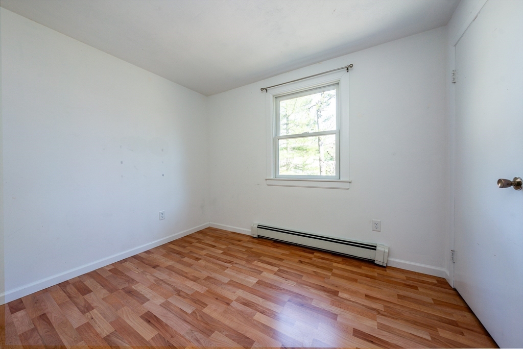 67 Crawford Road Barnstable, MA 02635 - Photo 15 of 26 an empty room with wooden floor and windows
