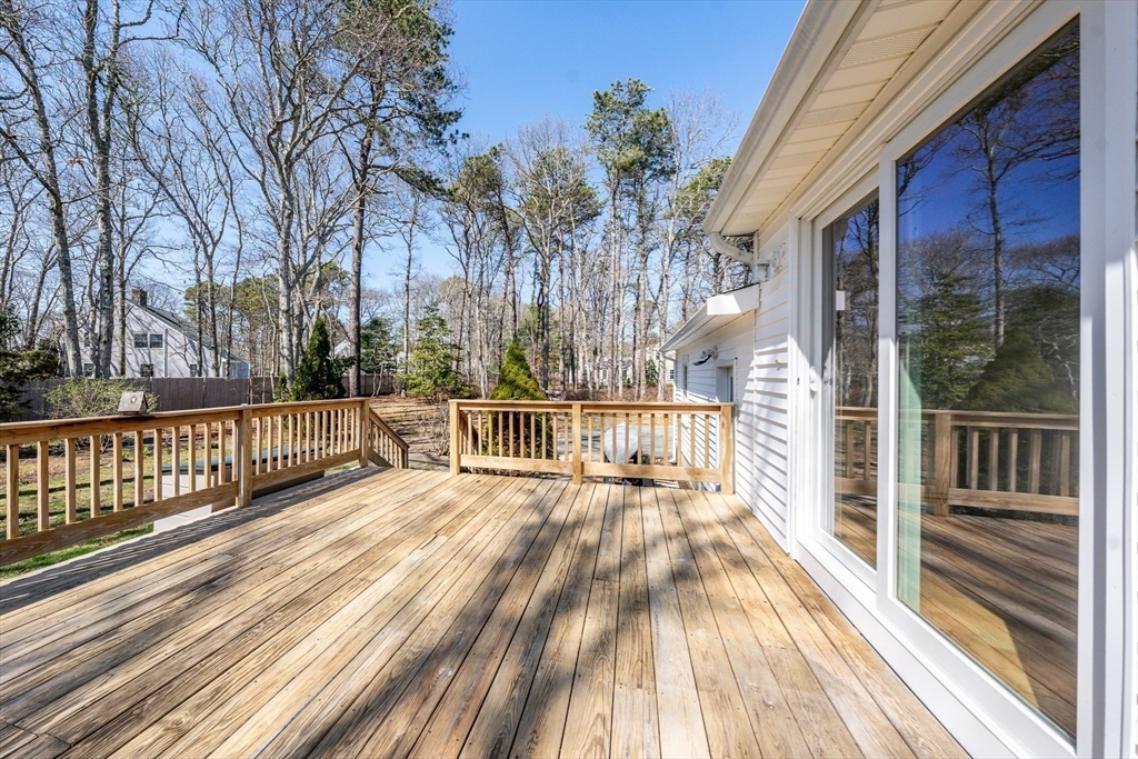 67 Crawford Road Barnstable, MA 02635 - Photo 17 of 26 a view of a balcony with wooden floor and fence
