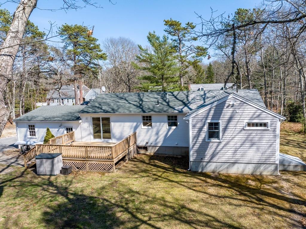 67 Crawford Road Barnstable, MA 02635 - Photo 21 of 26 a front view of a house with a yard and garage