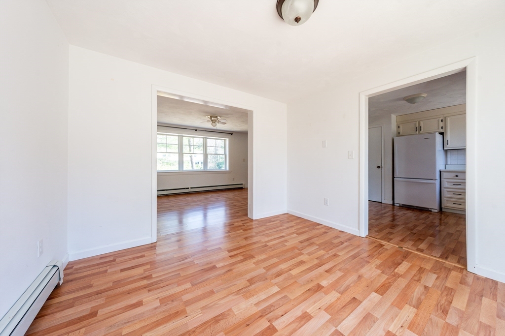 67 Crawford Road Barnstable, MA 02635 - Photo 5 of 26 an empty room with wooden floor and windows