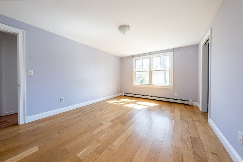 67 Crawford Road Barnstable, MA 02635 - Photo 10 of 26 an empty room with wooden floor and windows