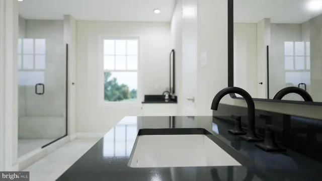 a view of a bathroom with tub and sink