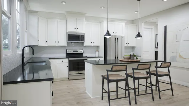 a kitchen with stainless steel appliances granite countertop a sink a stove and a refrigerator