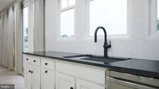 a close view of a sink and a counter space