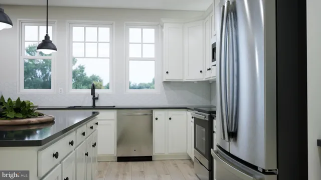 a kitchen with granite countertop a sink and a window